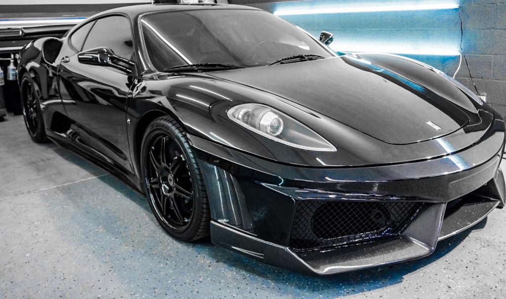 Black Ferrari 430 after paint protection film, front view