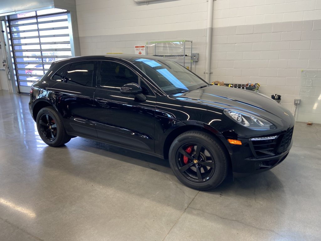 Black Porsche Macan with freshly tinted windows at Mando Auto Film in Las Vegas