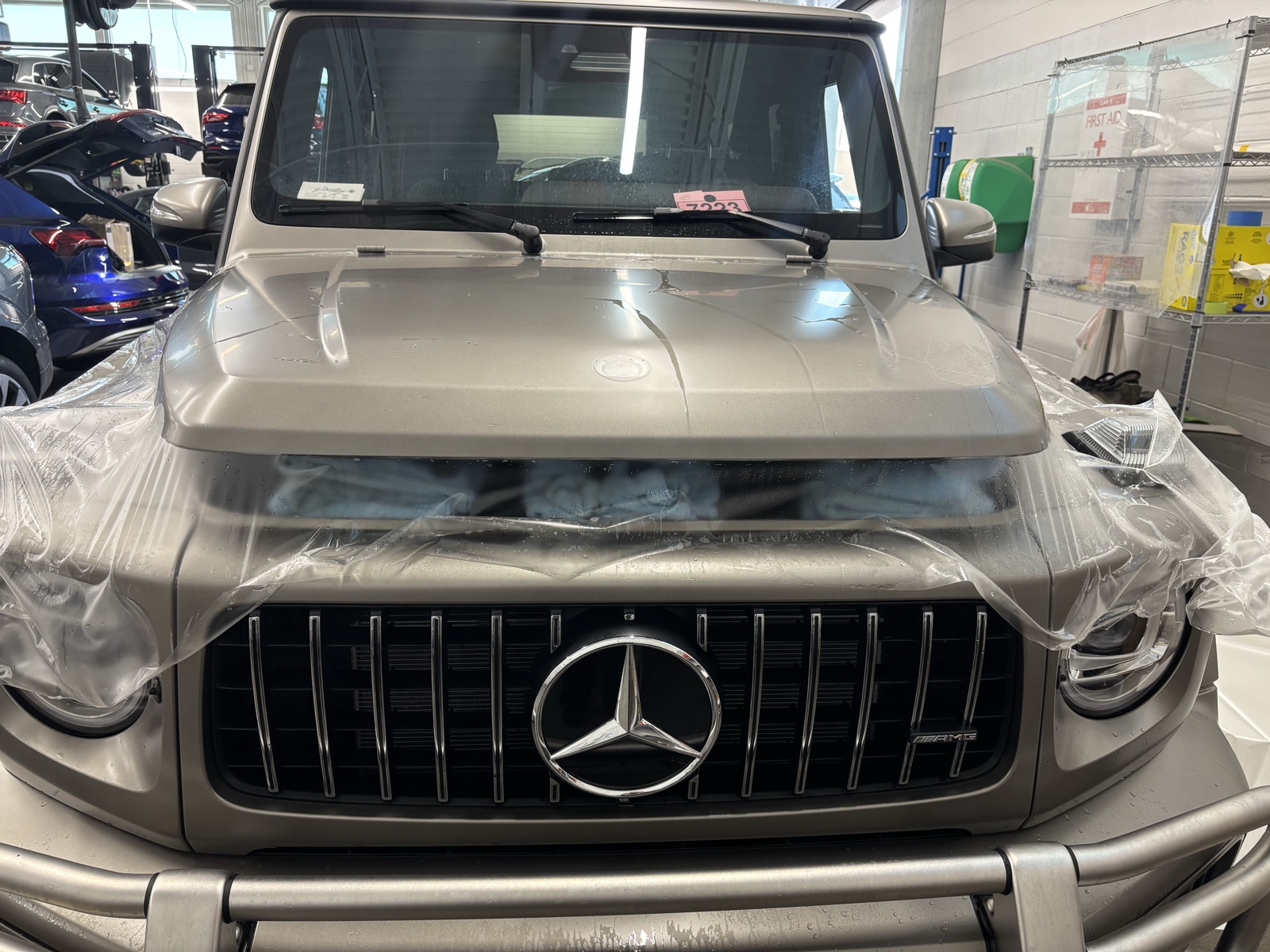 Matte paint protection film going onto the hood and front of a Mercedes G-Wagon