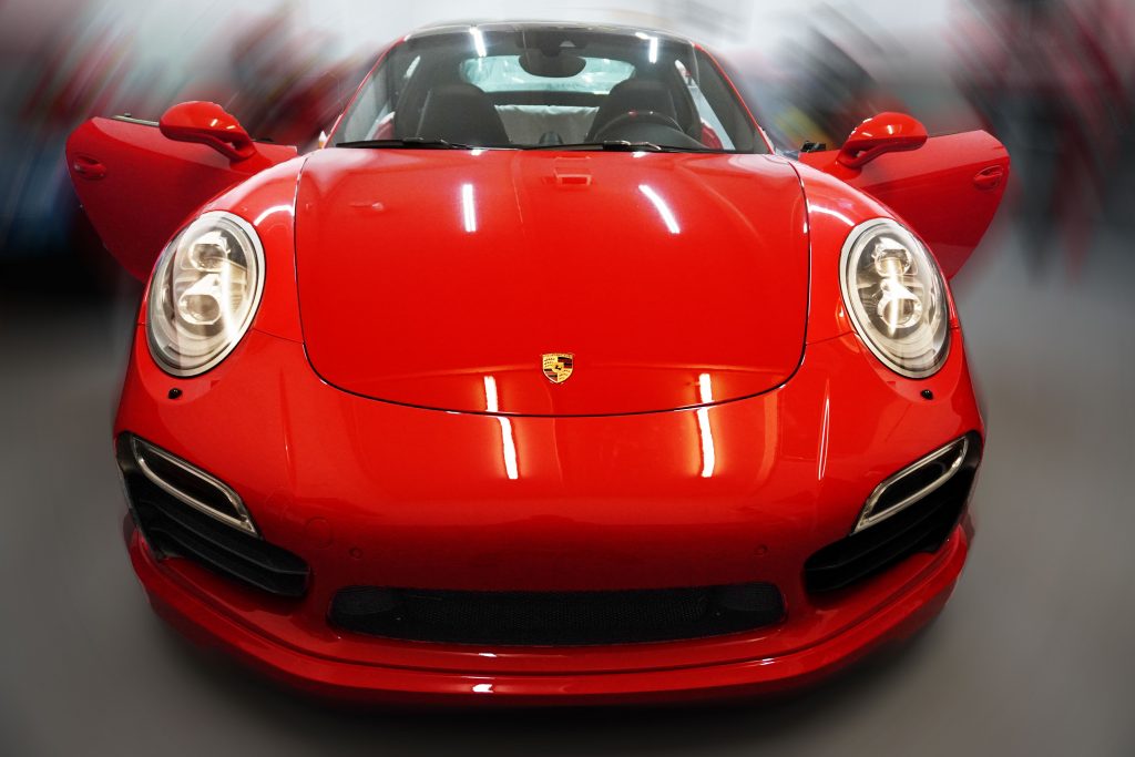 Red Porsche 911 in the shop, front view